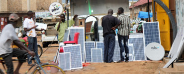 Solar panels are available for sale on a street in Uganda