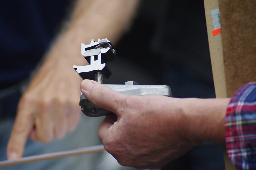 Charles Chamberlin holds the specialized mounting hardware