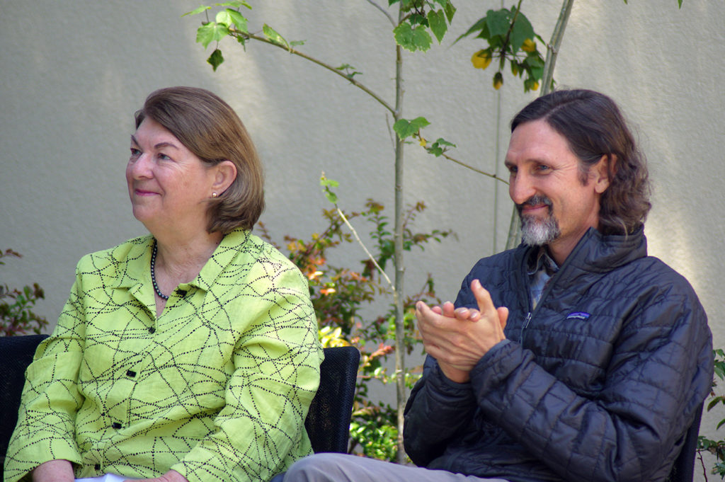 Andrea Tuttle and Jack West, smiling and applauding