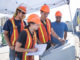 Students and staff in hardhats observe data from a torrefier