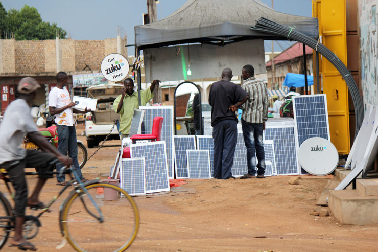 Solar panels are available for sale on a street in Uganda