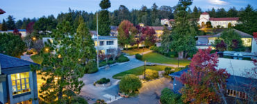 The HSU library, Siemens Hall and JVD courtyard is illuminated by nightlights, with Founders Hall in the distance