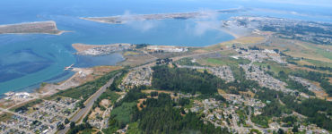 An aerial view of Humboldt Bay and the harbor jetties, from the southeast